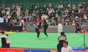 Aksi pesilat Jambi saat mengalahkan atlet NTB di PON Bela Diri Kudus