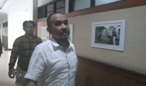 David Hadiosman saat keluar dari ruangan penyidik Diteskrimsus Polda Jambi